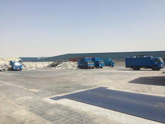 Industrial yard and parking area from an elevated view