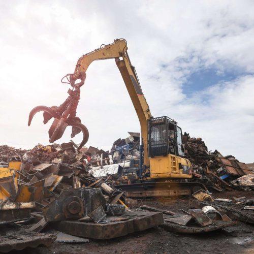 Heavy equipment sorting scrap metal